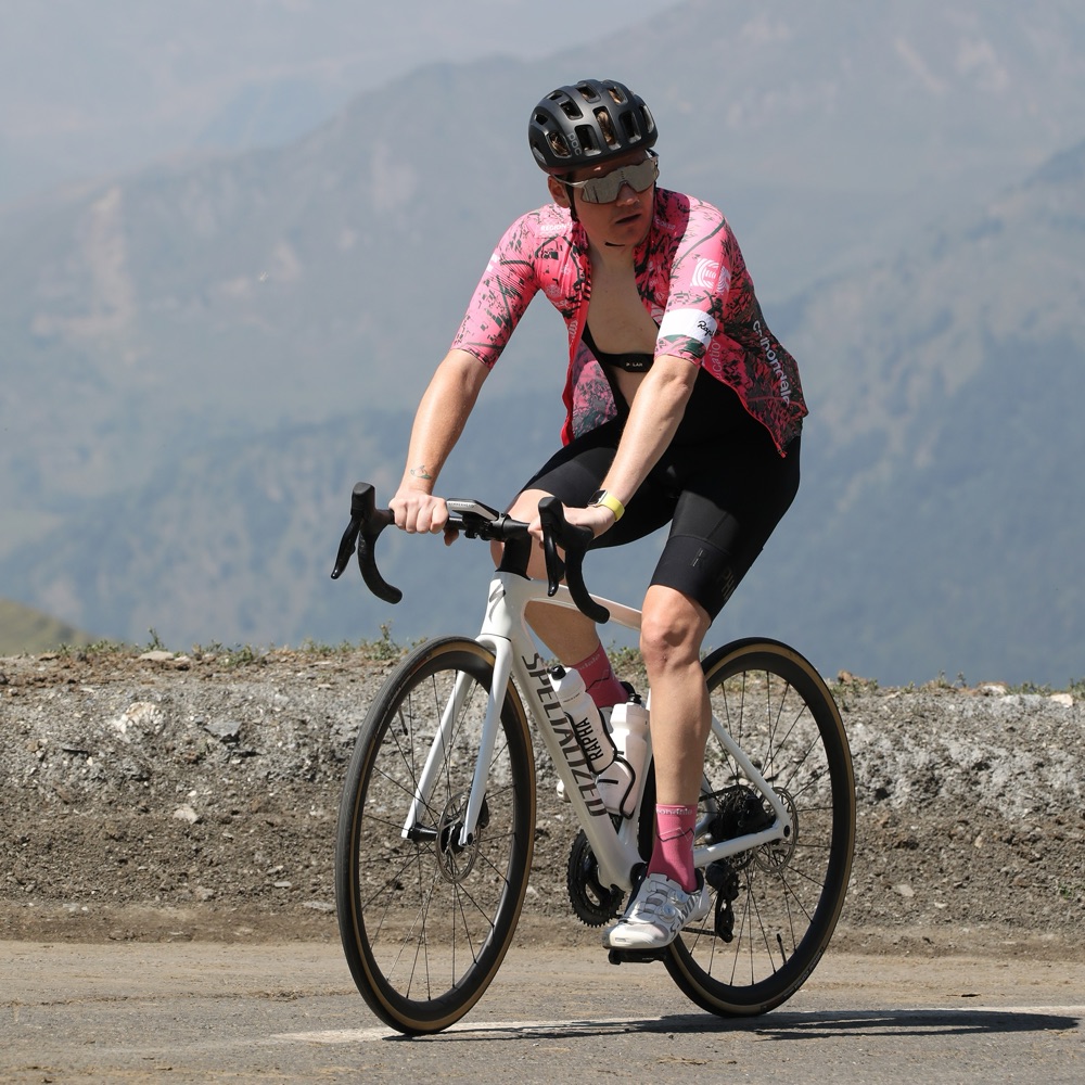 Ben Robinson riding a road bike on a mountain road